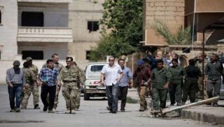 Brett McGurk serdana bajarê Reqayê dike