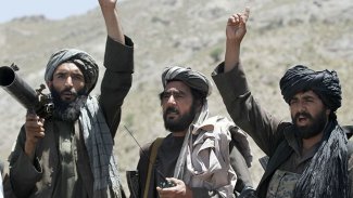 Taliban'dan Biden'a tehdit