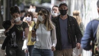DSÖ: İki doz aşı olanların maske takmaya devam etmesi gerekiyor
