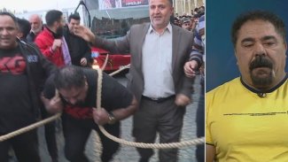 Kürt sporcu 42 tonluk otobüsü halatla çekti